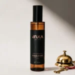 WYN Spray Aromatizante Premium 120 mL, botella ámbar con etiqueta cobre sobre fondo blanco