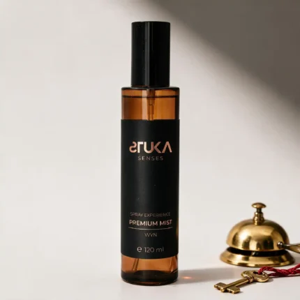 WYN Spray Aromatizante Premium 120 mL, botella ámbar con etiqueta cobre sobre fondo blanco